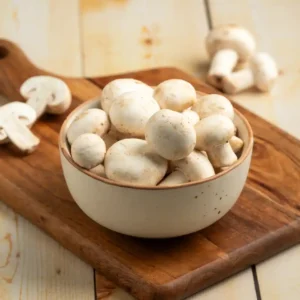 Fresh unwashed white button mushrooms grown at BSK Agro Farm in Barasat